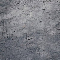 塗りムラがあるグレーのコンクリート調の壁の写真