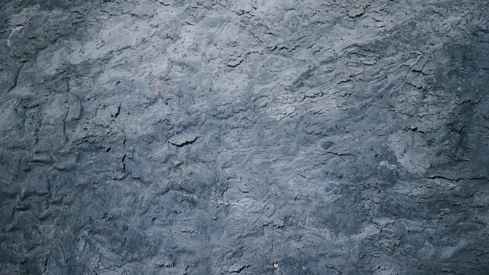 グレーの粘土質な壁面のテクスチャー素材