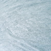 白いレースカーテンの繊細な織り模様のテクスチャーの写真