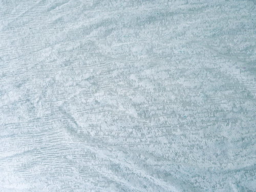 白いレースカーテンの繊細な織り模様のテクスチャー