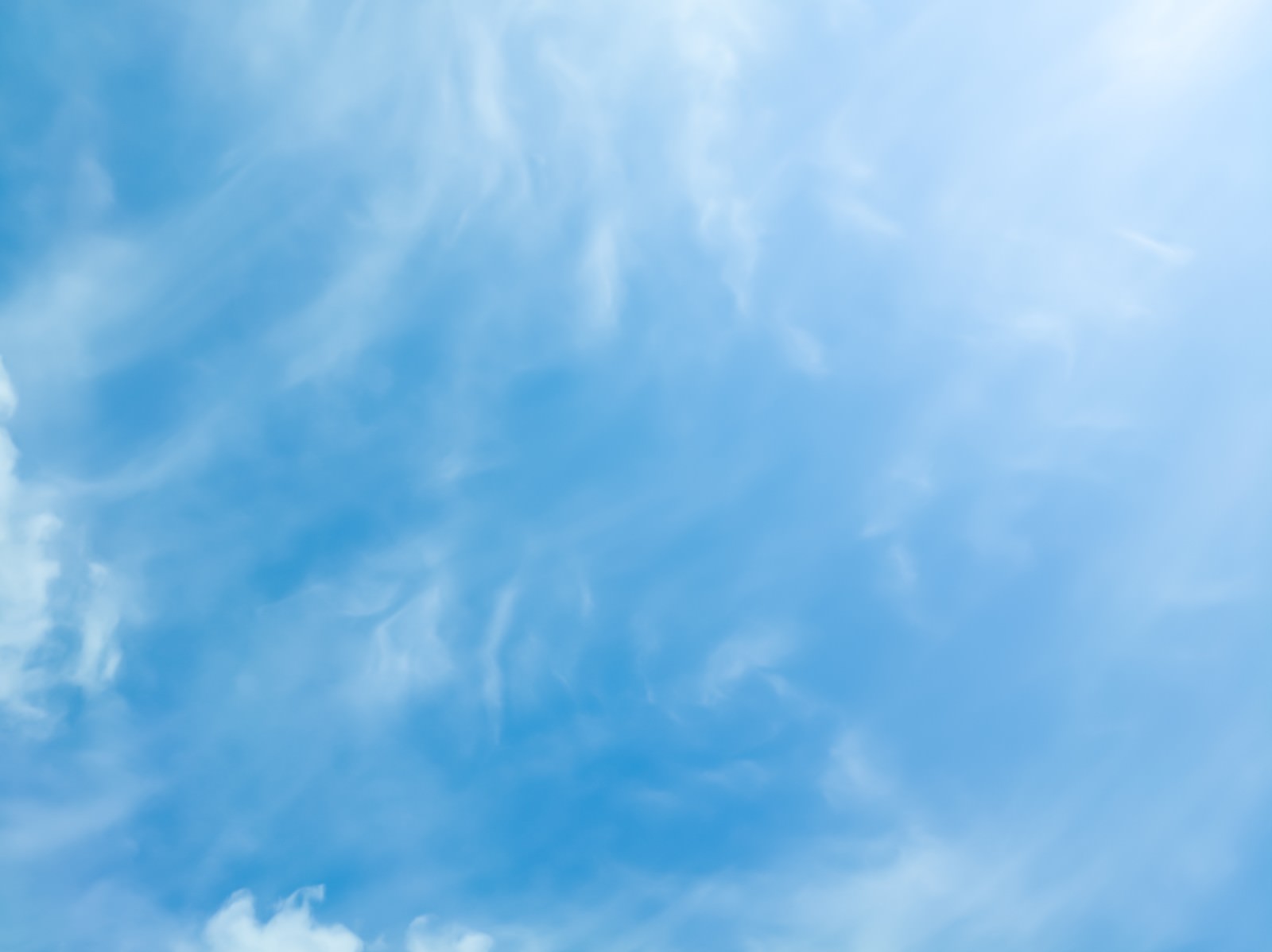 A clear sky with thin clouds