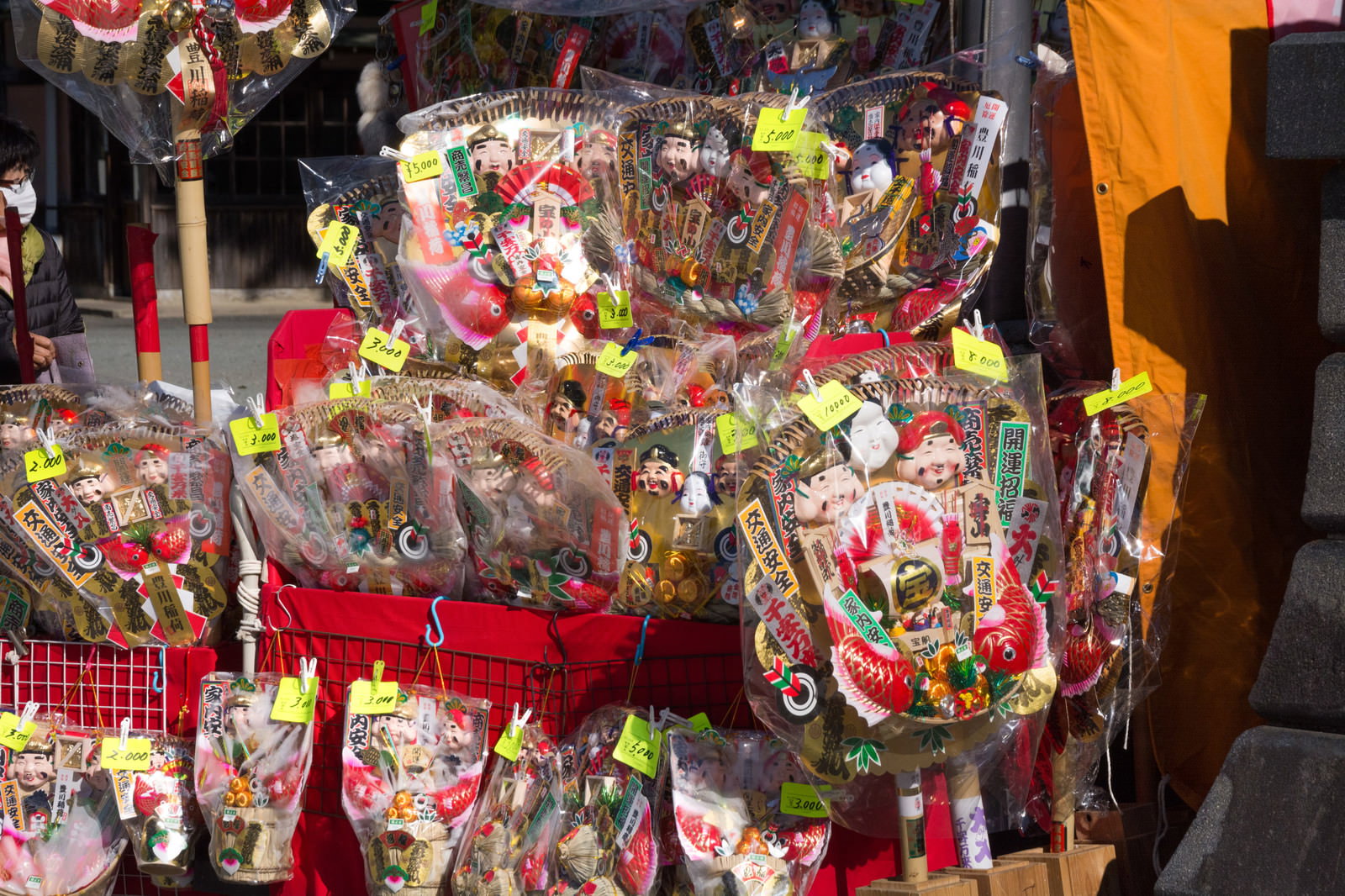 A variety of colorfully decorated rakes with price tags